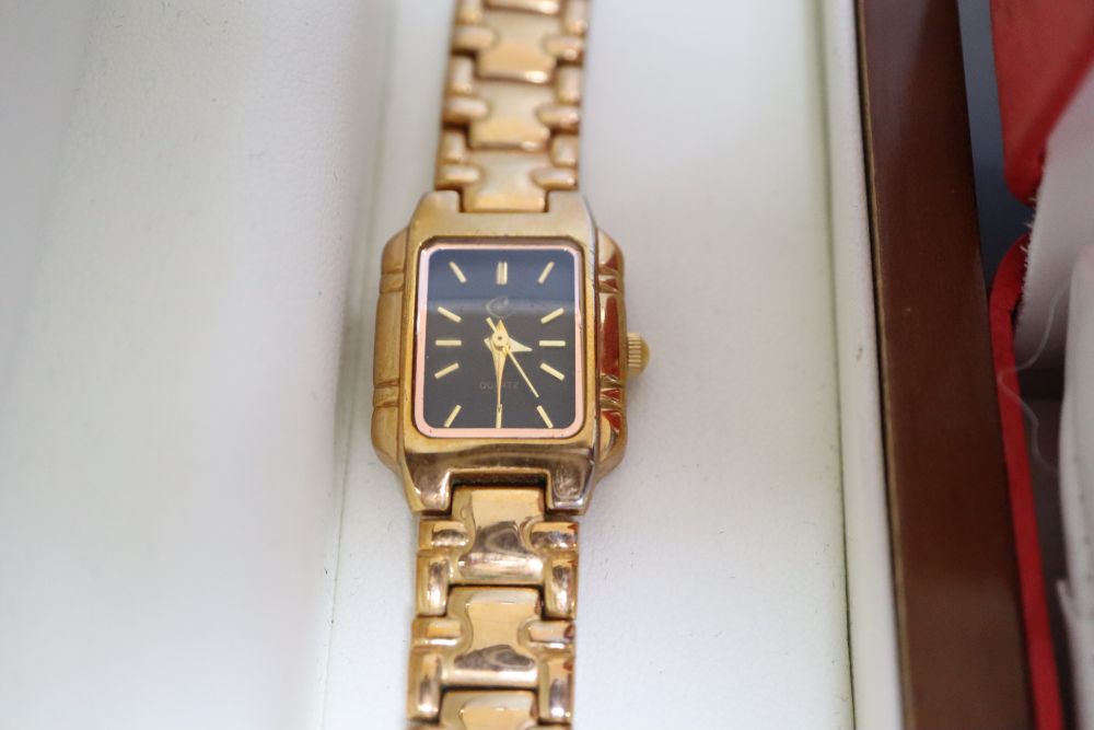 A collection of vintage and fashion ladies wristwatches,